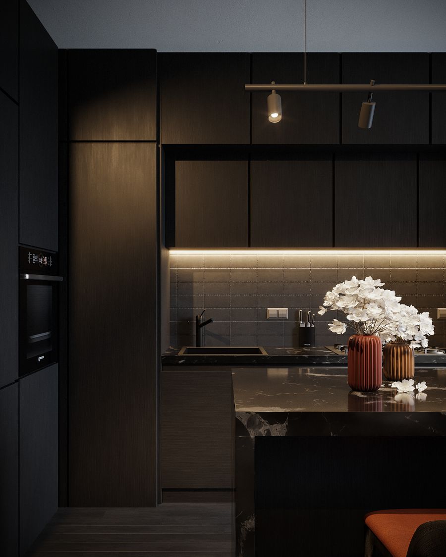 Cuisine noire avec éclairage intégré et bouquet de fleurs blanches